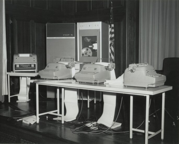 Black and white photo of computing equipment on display